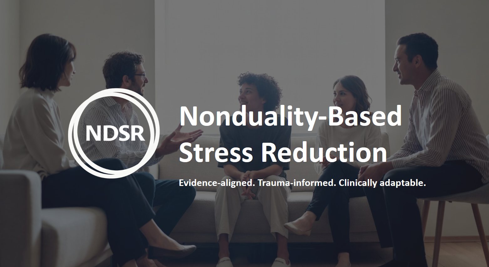 Nonduality-Based Stress Reduction: evidence-aligned, trauma-informed, clinically adaptable. A small group seated together in conversation.